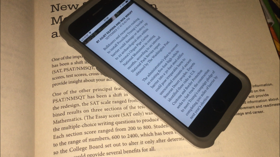 iPhone showing electronic text on top of classic paperback. Photo by David Seppelin