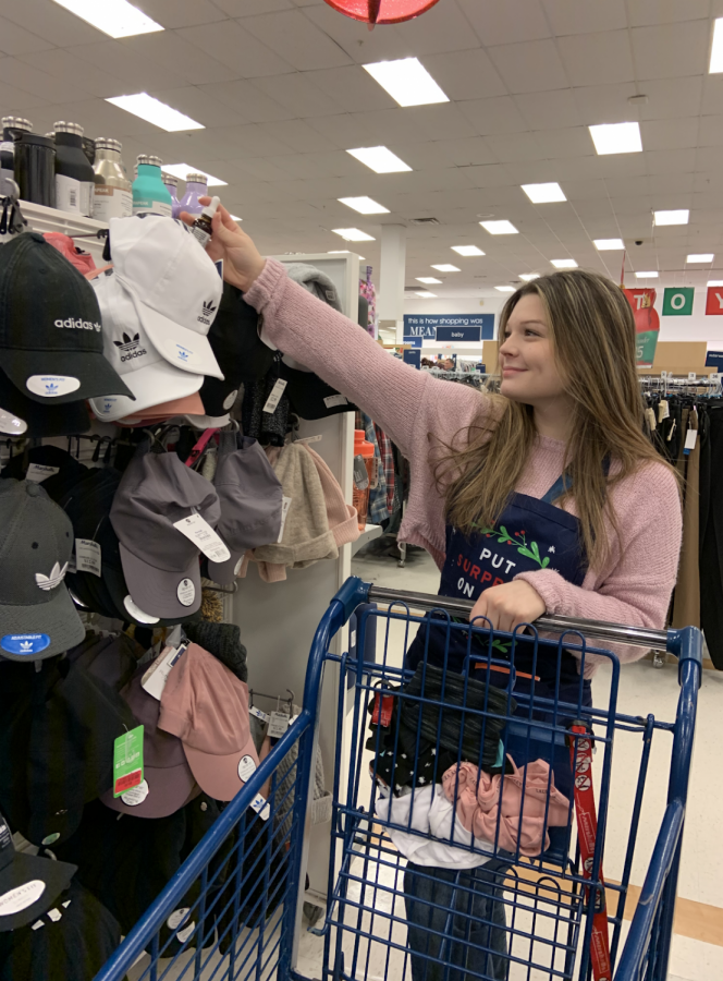 Lindsey LaFrance, a junior who works at Marshalls, putting items away.
