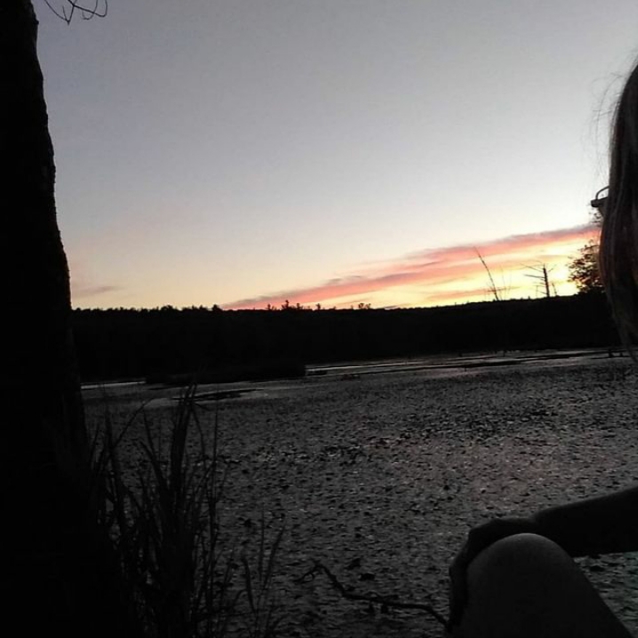 Dani Lewis watching the sunset for relaxation.