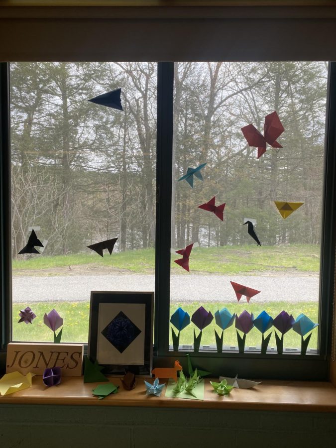 Ms. Gates displays her students’ origami skills