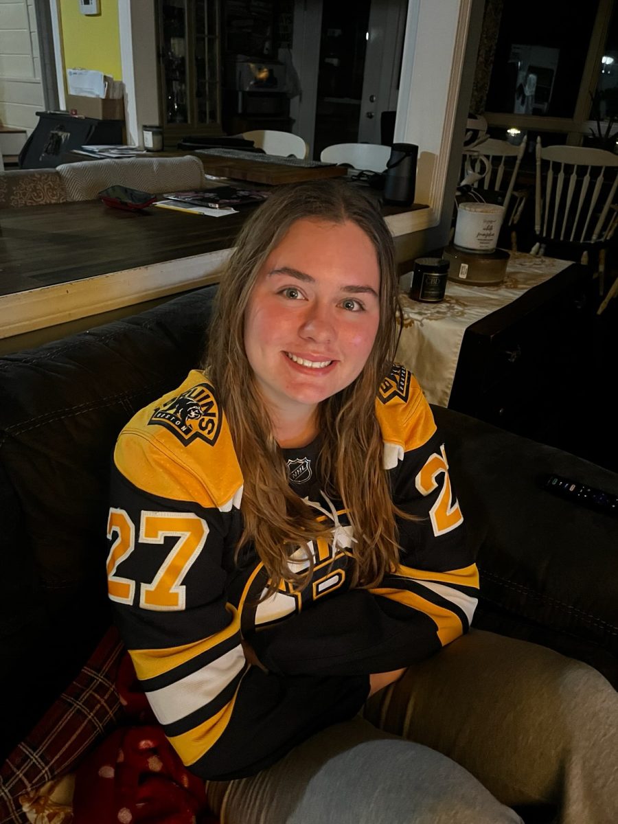 Bruins Fan Nola Patty throws on jersey and is ready to watch the game