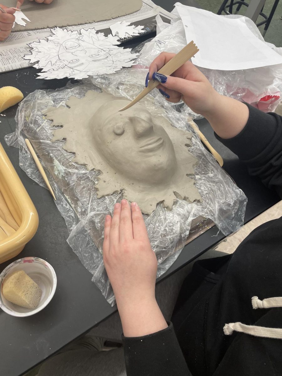 Hannah Wiseman shaping eyebrows out of clay!