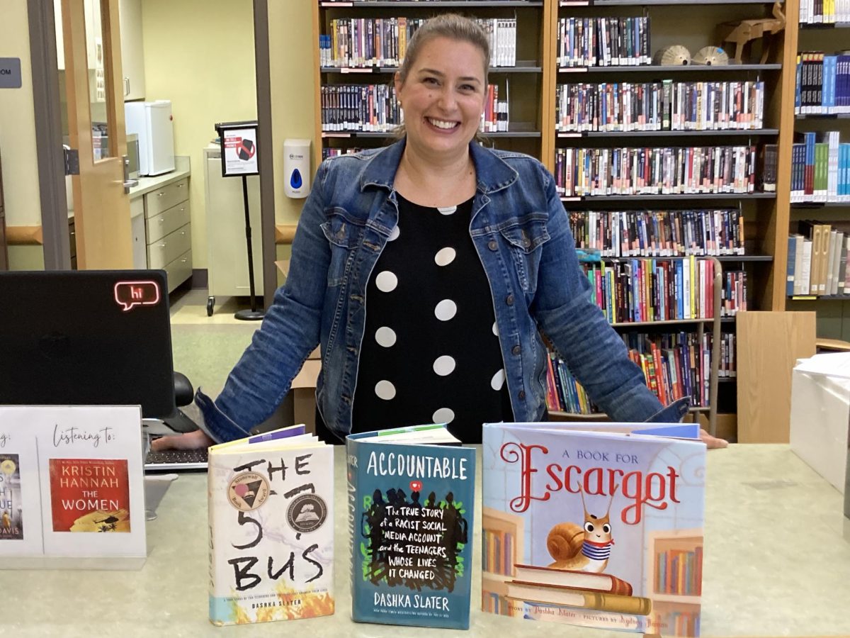 Mrs. Jenna Morin, who organized the event with Dashka Slater. With Slaters' books.   