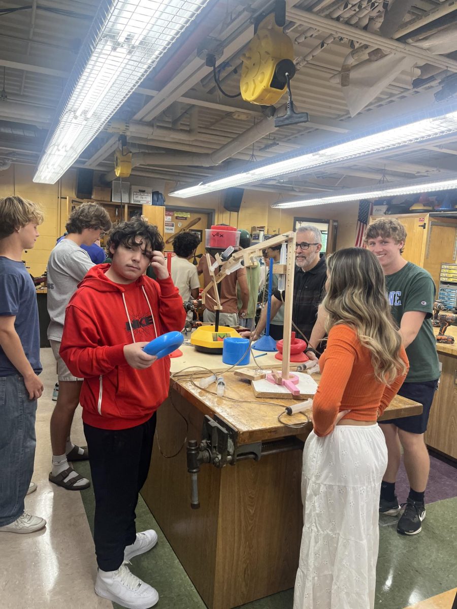 Mr. Secino's Engineering and Design class constructs hydraulic arms. 