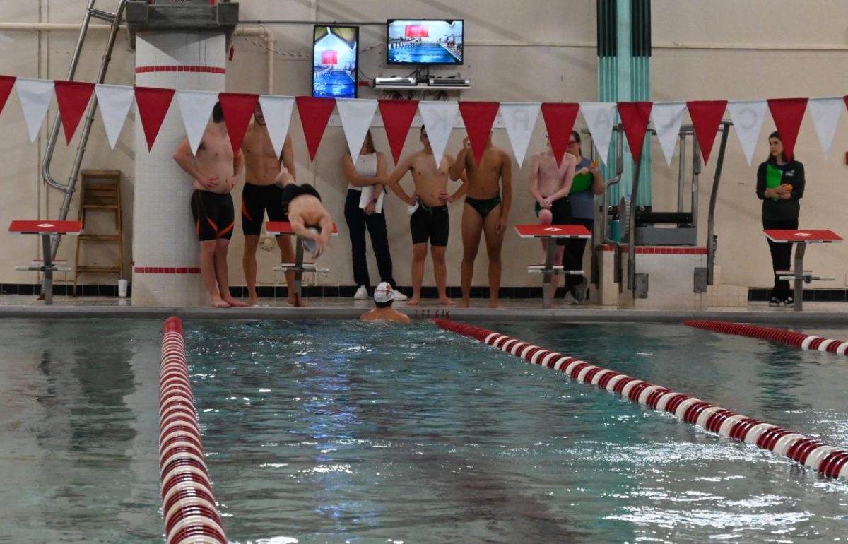 A Gardner swimmer dives in for the last leg of the 4 x 400 relay. 