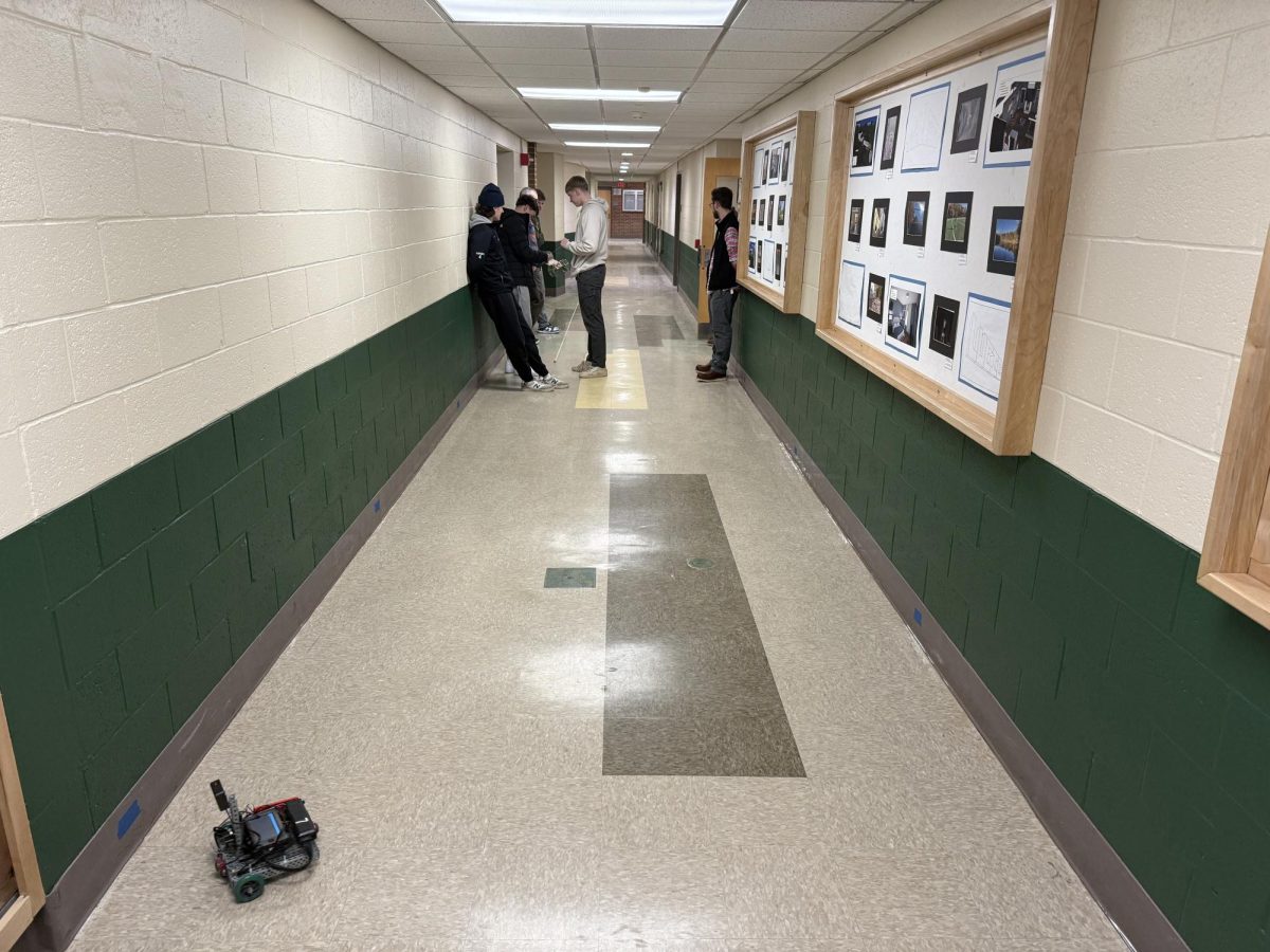 Students from Power, Energy, and Transportation test their new mini cars. Some traveled up to even 49 feet! 