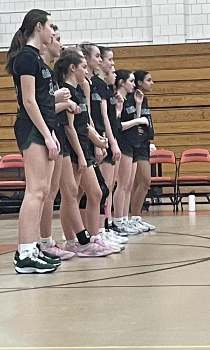 Girls basketball lines up for the anthem