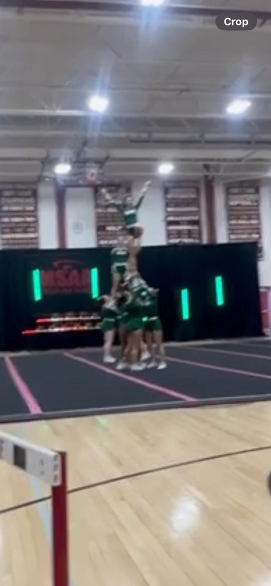 Oakmont Cheer Team nails partner stunt at recent competition.