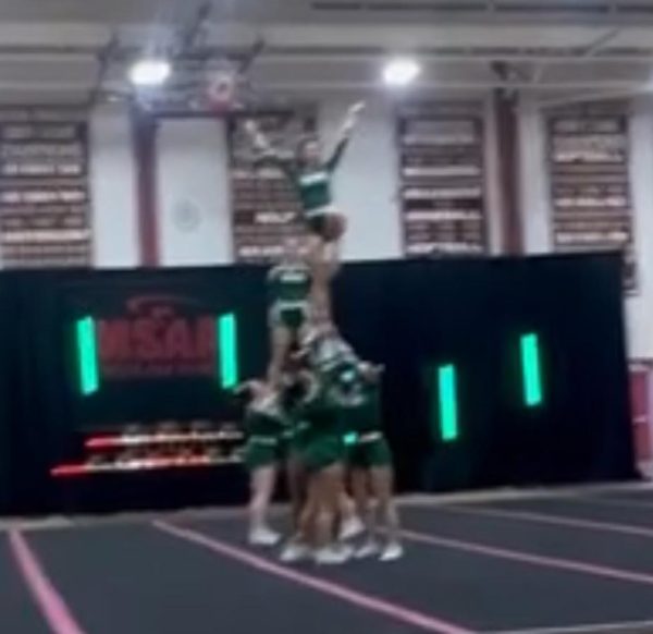 Oakmont Cheer Team nails partner stunt at recent competition.