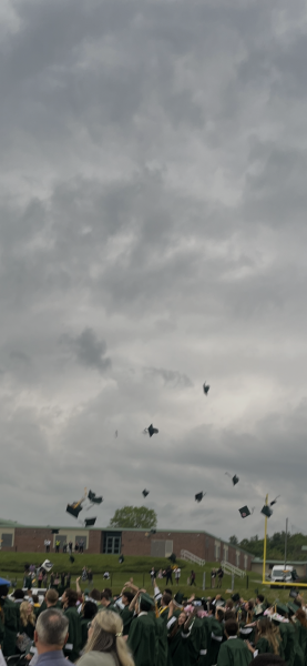 Caps in the air!