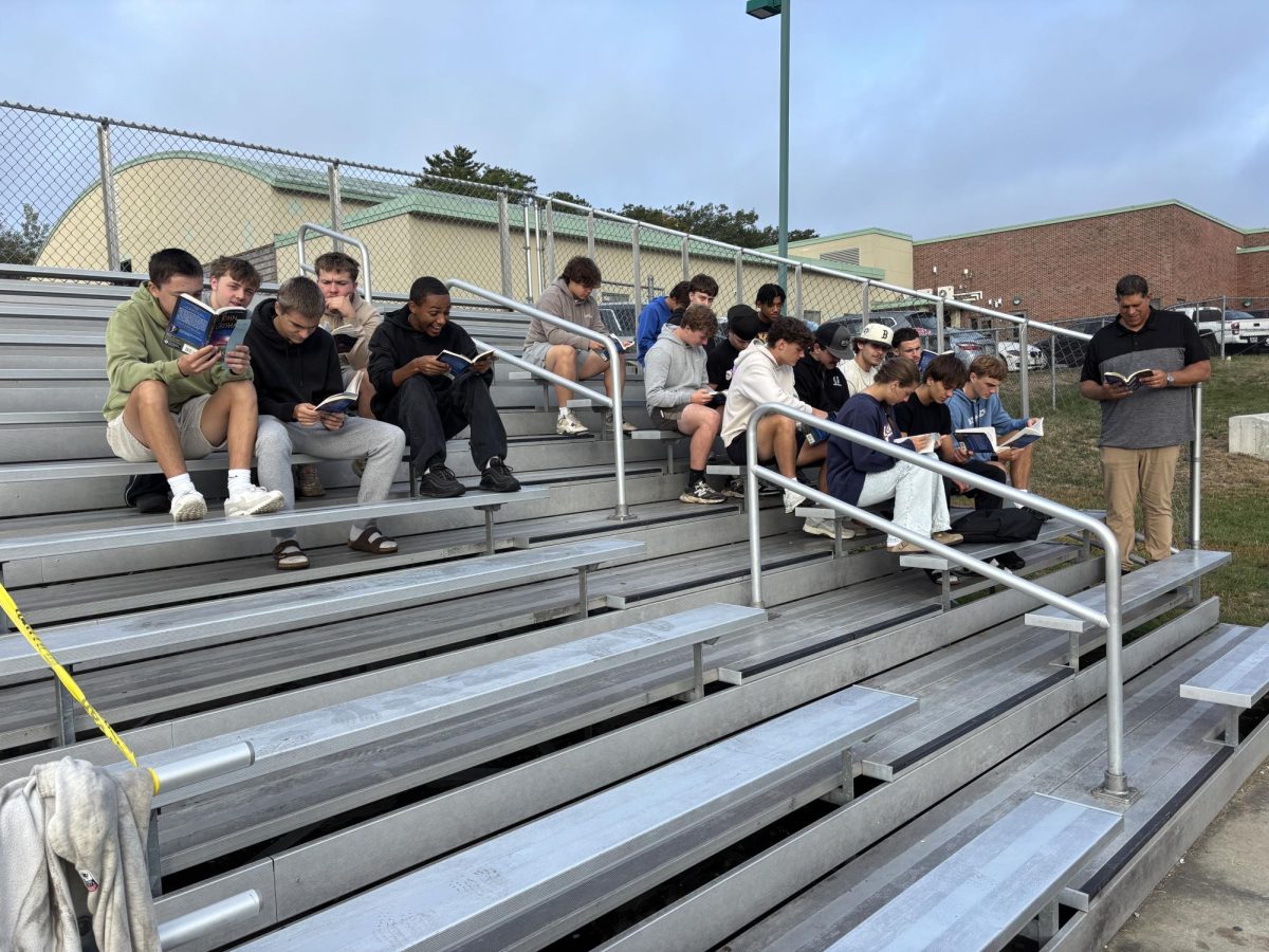 Sports Lit seniors read John Grisham's Bleachers on the Oakmont bleachers on a warm September morning.
