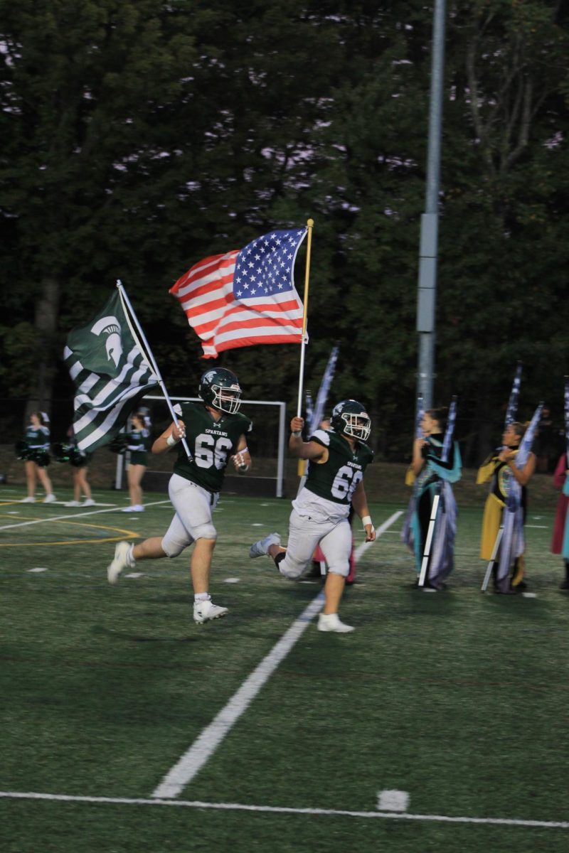 Spartans proudly representing their team and country. 