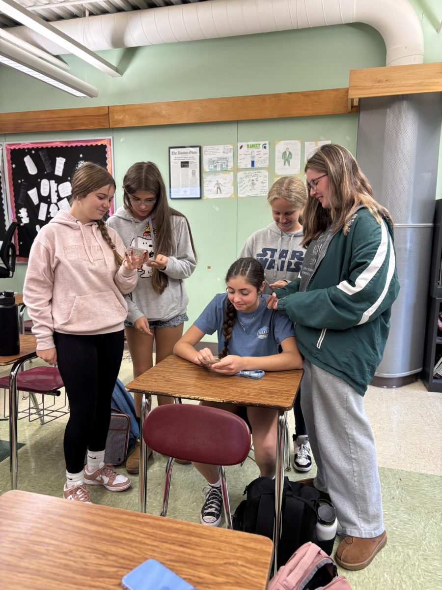 Students looking at their ID's