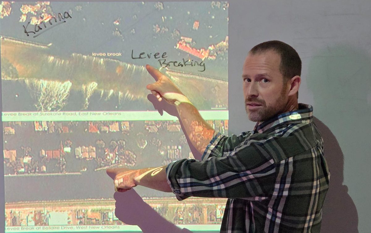 Teacher Daniel Dufour showing us the levees giving out during hurricane katrina 
