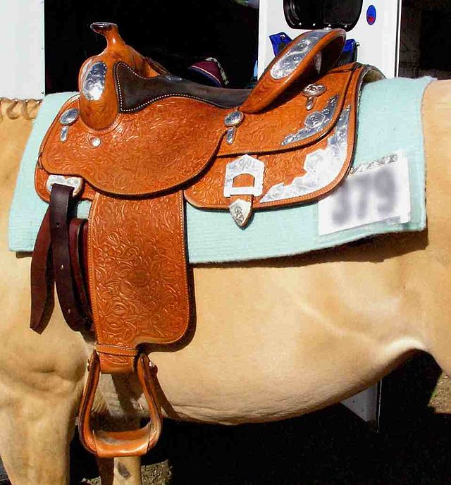 A western saddle with additional silver, suitable for a horse show (CCL)
