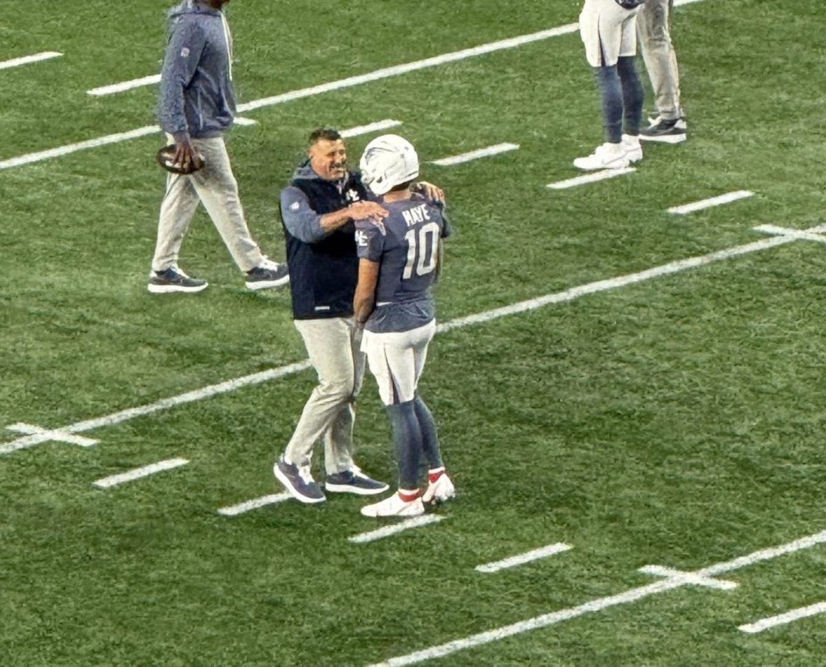 Drake Maye getting a pep talk from Patriots head coach Mike Vrabel.
