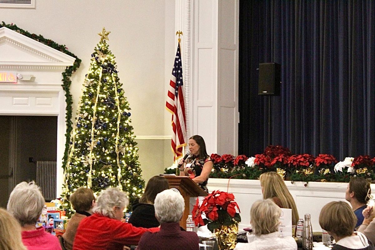 Group leader‒Lynn Cormier-Sayarath‒starts the night off with a speech. 