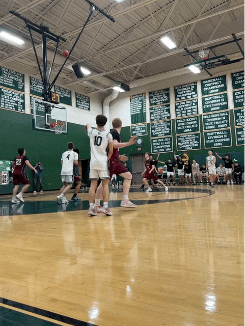 Braden 'Ferb' Girouard sinks a three-pointer.