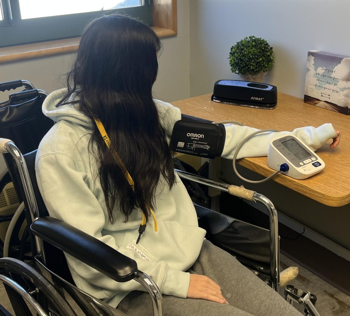 Student battles injury making sure her blood pressure and pulse don't signify stress.