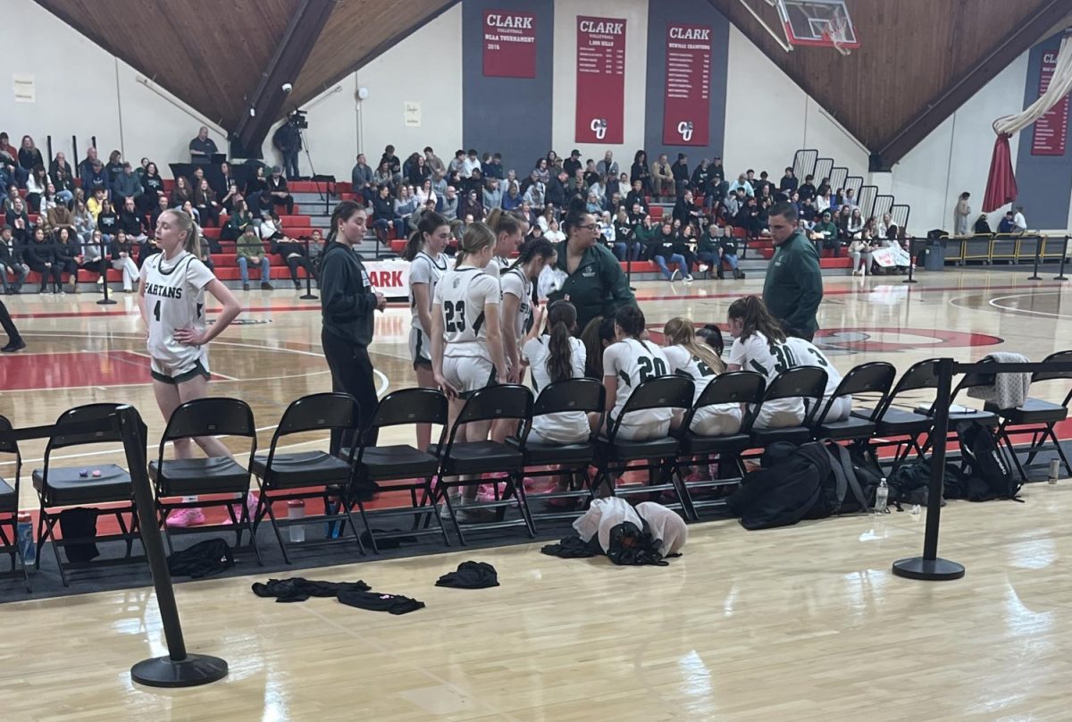 Oakmont team meets during timeout in a very close game.