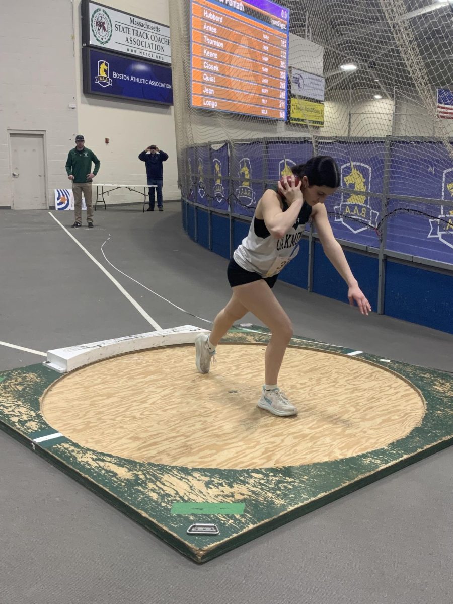 Jocelyn C throwing shot put.  