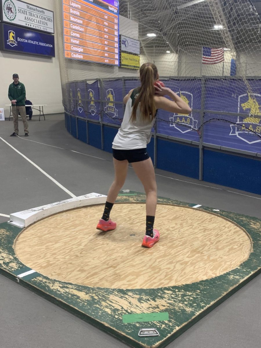 Katherine H throwing shot put.