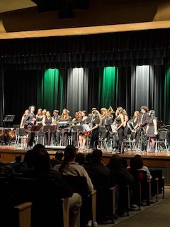 Oakmont's Concert Band stands after performance