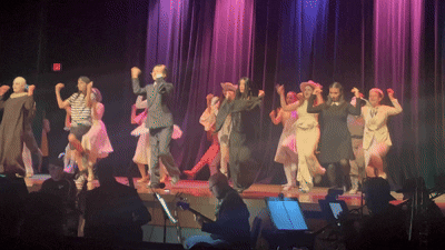 The cast of The Addams Family dancing to the opening number, When You’re an Addams.