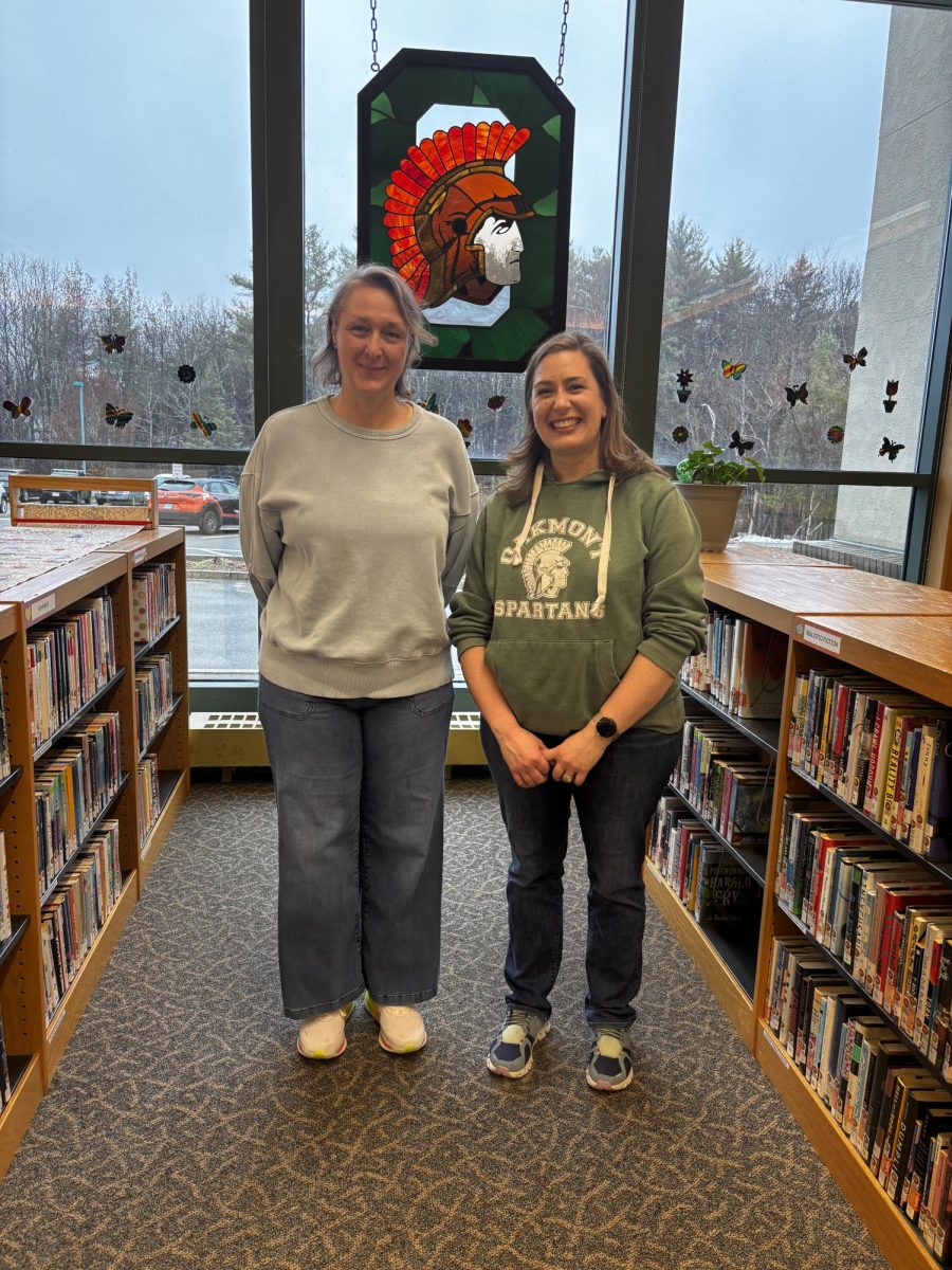 Morin and Vance pose for a picture in the David Nims Library