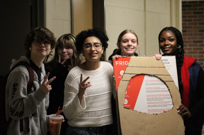 Students hunting down missing props during final preparations. 