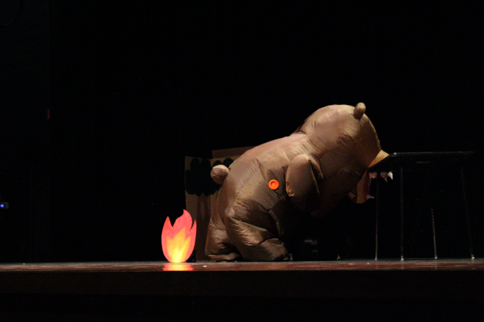 A student dressed up as a bear stealing food, for the March Madness performances. 