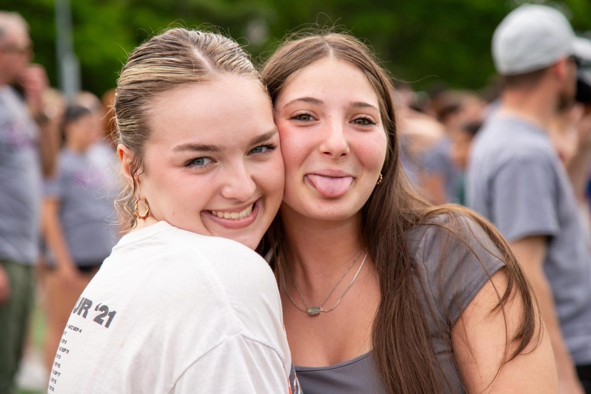 Juniors Chloe Kruse and Cayleigh Imprescia share big smiles before tug-of-war begins.