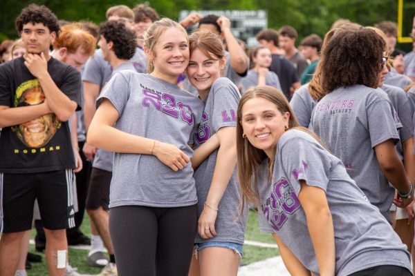 Seniors Layce Lauletta, Gianna Gerbick, and Megan Wolanske before competing in tug-of-war.