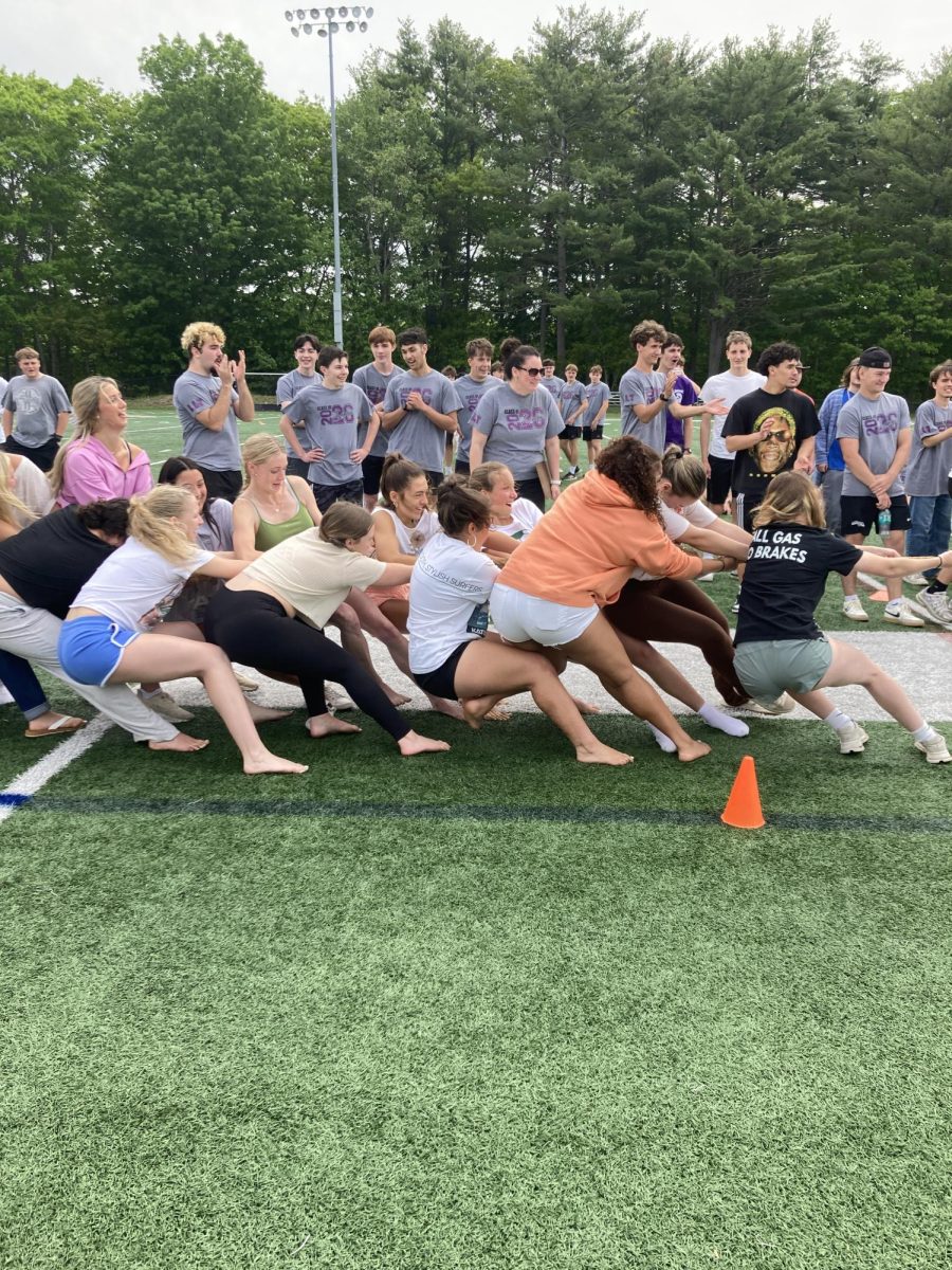 Junior girls playing tug-of-war and having a lot of fun.
