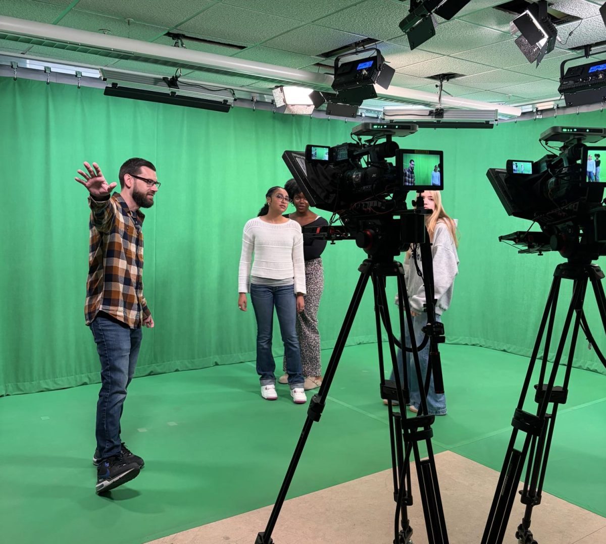 Access Coordinator, Mike Milligan, showing Oakmont students how the studio equipment works.