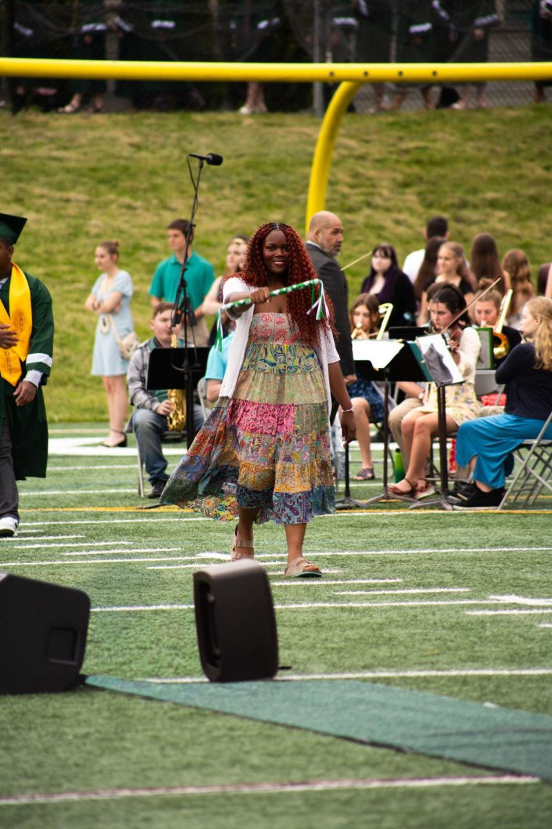 Oakmont Class of 2027 President Nadalee Madhere leads the senior class into the ceremony.