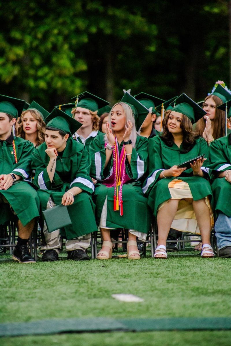 Oakmont senior Keilana Carbonneau cheers on her friends as they receive their diplomas.